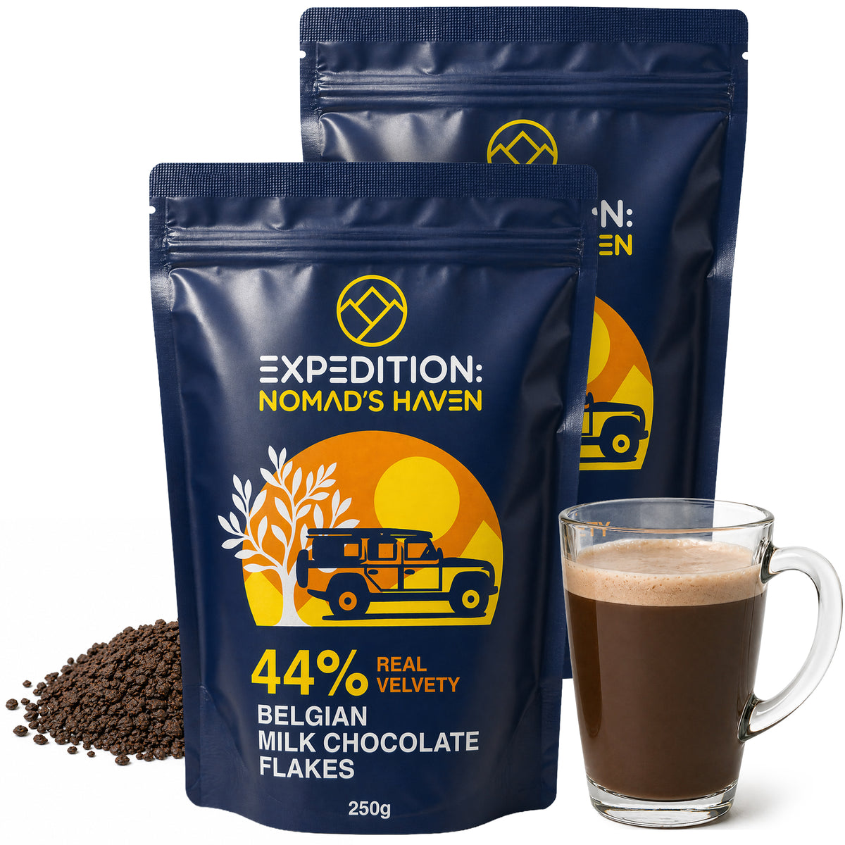 Two 250g pouches of Expedition Nomad's Haven 44% Belgian milk chocolate flakes, 500g total, with a glass mug of hot chocolate