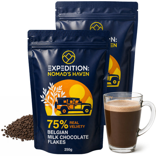 Two 250g pouches of Expedition Nomad's Haven 75% Belgian dark chocolate flakes, 500g total, with a glass mug of hot chocolate